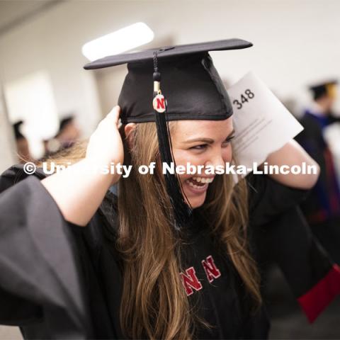 Jocelyn Whittrock adjusts her mortar board before commencement. 2019 Summer Commencement at Pinnacle Bank Arena. August 17, 2019. Photo by Craig Chandler / University Communication.