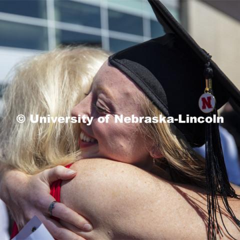 Jennifer Mesmer is surrounded by family and friends following commencement. 2019 Summer Commencement at Pinnacle Bank Arena. August 17, 2019. Photo by Craig Chandler / University Communication.