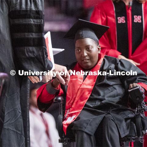 Amori Strong receives her degree. She graduated after leaving the Lincoln area because of health reasons and completing her degree online. She returned for the ceremony. 2019 Summer Commencement at Pinnacle Bank Arena. August 17, 2019. Photo by Craig Chandler / University Communication.