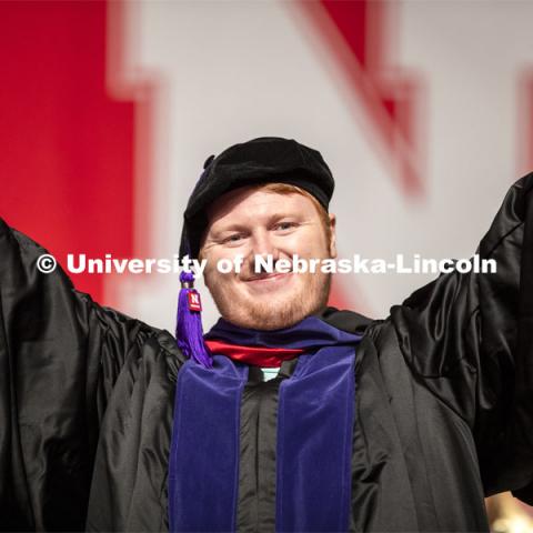 Maxwell Anderson gestures after receiving his law degree JD Saturday morning. 2019 Summer Commencement at Pinnacle Bank Arena. August 17, 2019. Photo by Craig Chandler / University Communication.