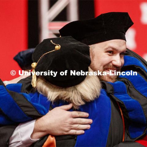 Zachary Myers hugs his advisor Sue Swearer after he received his doctoral hood. 2019 Summer Commencement at Pinnacle Bank Arena. August 17, 2019. Photo by Craig Chandler / University Communication.