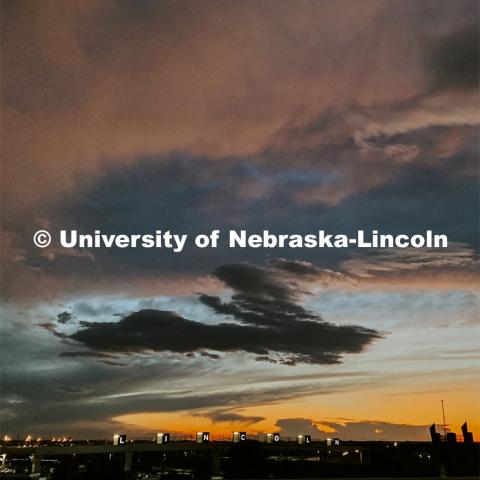 Sunset over the pedestrian bridge between Haymarket and Haymarket Park, Lincoln, Nebraska. August 19, 2019. Photo by Taylor DeMaro / University Communication.