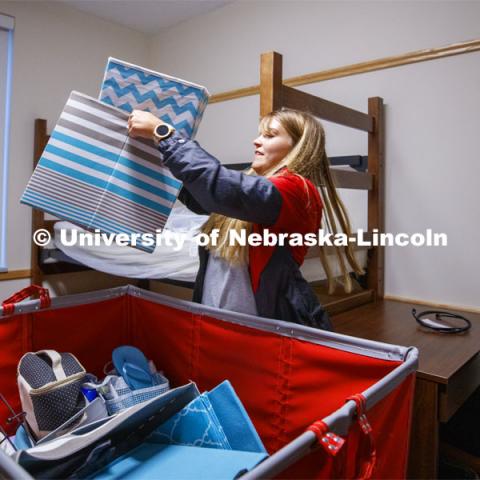 Taylor Gregory from Hooper, Nebraska, unloads her belongings into her Massengale Residential Center room. August 21, 2019. Photo by Craig Chandler / University Communication.