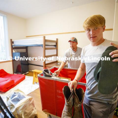 Tyson Olson, an animal science and pre-vet major from Madison, Minnesota, unpacks in his Massengale Residential Center move in. August 21, 2019. Photo by Craig Chandler / University Communication.