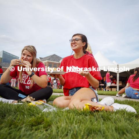 Madi Waltman of Waukee, IA, left, and Brooke Kimpson of Papillion, NE, talk with new friends at the BBQ. Big Red Welcome, Chancellor's BBQ for incoming freshman and new students on the greenspace by the Memorial Union. August 23, 2019. Photo by Craig Chandler / University Communication.