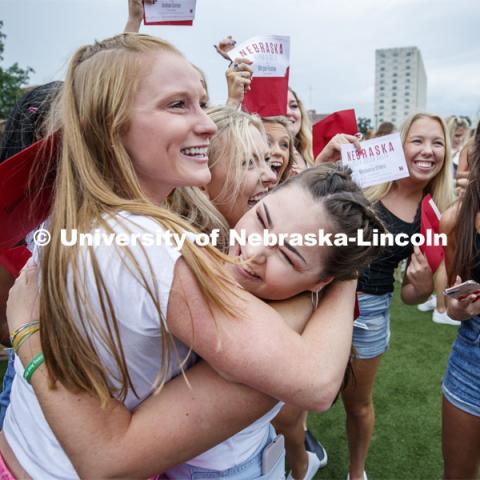 New sorority members celebrate their bids as they open their invitations on the intramural fields. Sorority Bid Day. August 24, 2019. Photo by Craig Chandler / University Communication.