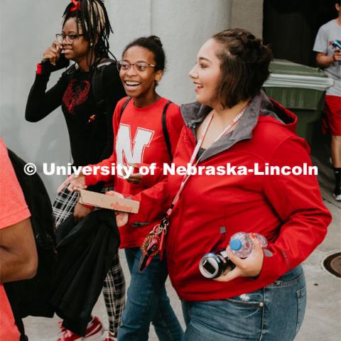 Students walking into Memorial Stadium. Students got to check out the 2019 Husker Football Team at the Big Red Welcome Boneyard Bash. The first 2500 students got a free slice of Valentino’s pizza, water, and a 2019 Official Boneyard t-shirt. August 24, 2019. Photo by Justin Mohling / University Communication.