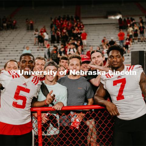 Football players meeting fans and students. Student making a catch and the team going wild, she was the only one to catch the ball. Students got to check out the 2019 Husker Football Team at the Big Red Welcome Boneyard Bash. The first 2500 students got a free slice of Valentino’s pizza, water, and a 2019 Official Boneyard t-shirt. August 24, 2019. Photo by Justin Mohling / University Communication.