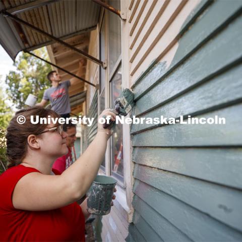 First year law students, faculty and staff paint two Lincoln houses. The painting is a yearly tradition for the incoming students. August 24, 2019. Photo by Craig Chandler / University Communication.