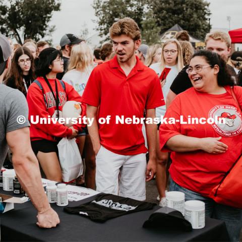 Students getting involved with an RSO. Students had the opportunity to engage with more than 350 booths hosted by local business, student organizations and clubs, UNL departments and more at the Big Red Welcome Street Festival. There were free food, prizes, and giveaways. August 24, 2019. Photo by Justin Mohling / University Communication.