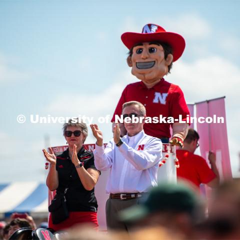 Herbie, Ronnie and Jane Green cheer on the band. The University of Nebraska represents and celebrates their 150th year anniversary at the Nebraska State Fair in Grand Island, Nebraska. August 1, 2019. Photo by Justin Mohling for University Communication.