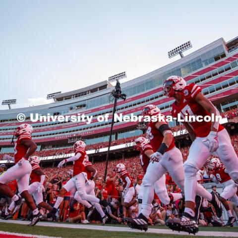 Coach Scott Frost leads his team onto the field for the Nebraska vs. Northern Illinois football game. September 14, 2019. Photo by Craig Chandler / University Communication.