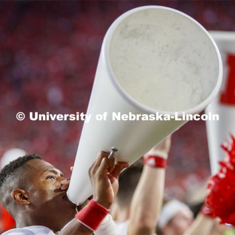 Ramarro Lamar, one of the male cheerleaders, leads the crowd in a cheer. Nebraska vs. Northern Illinois football game. September 14, 2019. Photo by Craig Chandler / University Communication.