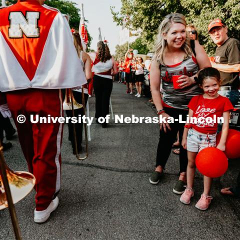 Kid excited to see The Cornhusker Marching Band march by. Nebraska vs. Northern Illinois football game. September 14, 2019. Photo by Justin Mohling / University Communication.