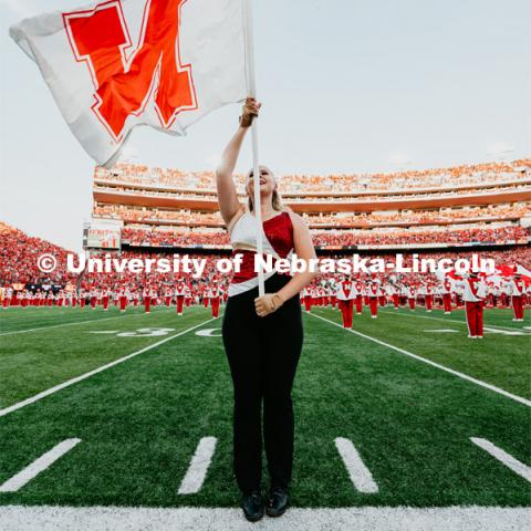 Cornhusker Marching Band Color Guard member on the field. Nebraska vs. Northern Illinois football game. September 14, 2019. Photo by Justin Mohling / University Communication.