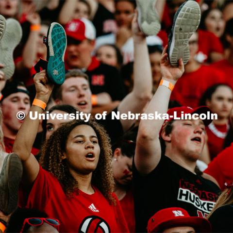 Students with shoes up for Shoes Off- Kickoff. Nebraska vs. Northern Illinois football game. September 14, 2019. Photo by Justin Mohling / University Communication.