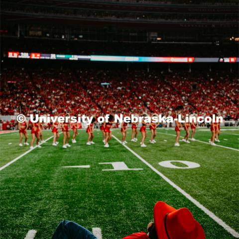 Herbie Husker lounges on the sideline as the Scarlets preform at the Nebraska vs. Northern Illinois football game. September 14, 2019. Photo by Justin Mohling / University Communication.