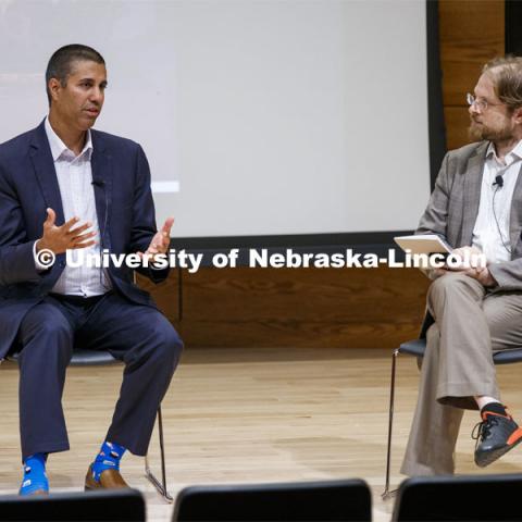 Ajit Pai, chairman of the Federal Communications Commission, and Gus Hurwitz, Co-Director, Space/Cyber/Telecomm Program and College of Law Associate Professor, talk at a fireside chat in the Nebraska Union auditorium. Pai visited the University of Nebraska–Lincoln on Sept. 18. The visit is hosted by the University of Nebraska College of Law’s Space, Cyber and Telecommunications Law program and its co-director Gus Hurwitz. September 18, 2019. Photo by Craig Chandler / University Communication.