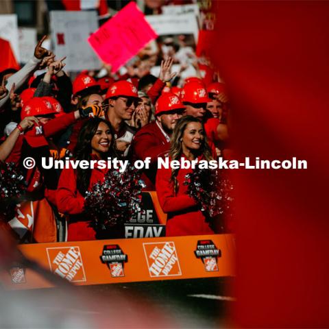 Nebraska cheer squad and fans wearing Home Depot hard hats. Nebraska vs. Ohio State University football game. September 28, 2019. Photo by Justin Mohling / University Communication.