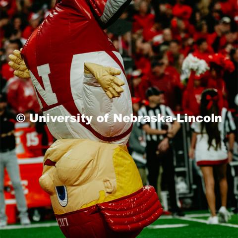 Lil’ red jumping on his head in the middle of Memorial Stadium. Nebraska vs. Ohio State University football game. September 28, 2019. Photo by Justin Mohling / University Communication.