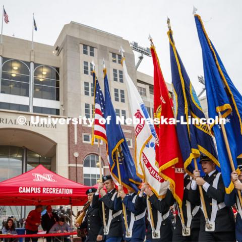 ROTC color guard leads the parade past Memorial Stadium. Cornstock celebration and Homecoming Parade. October 4, 2019. Photo by Craig Chandler / University Communication.