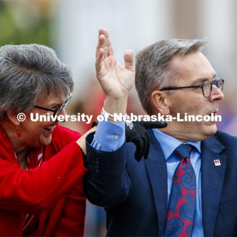 Chancellor Ronnie Green and his wife, Jane, wave to friends as they pass the stadium. Cornstock celebration and Homecoming Parade. October 4, 2019. Photo by Craig Chandler / University Communication.