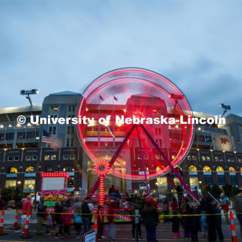 A Ferris wheel on the east side of Memorial Stadium gave its riders a view of the stadium loop. Cornstock celebration and Homecoming Parade. October 4, 2019. Photo by Craig Chandler / University Communication.