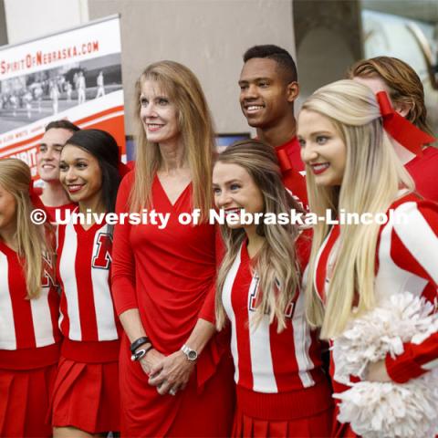 Debra Kleve White, alumni and former member of then-named yell squad, poses with the current cheer squad before she presents the Homecoming Nebraska Lecture, “Louise Pound and the History of UNL School Spirit”. October 4, 2019. Photo by Craig Chandler / University Communication.
