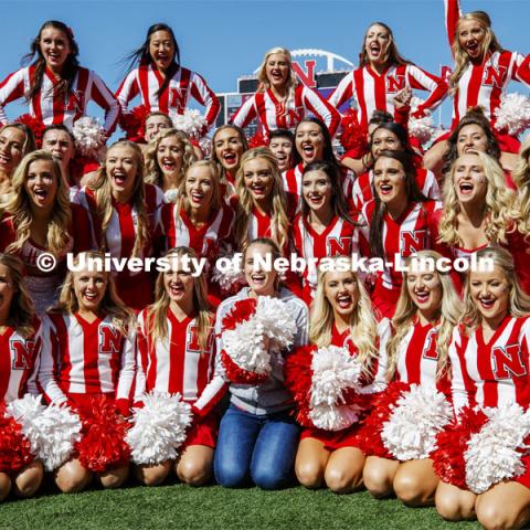 Hannah Huston, from the tv show The Voice, poses with the cheer squad before the game. Nebraska vs. Northwestern University football game. Homecoming 2019. October 5, 2019.  Photo by Craig Chandler / University Communication.