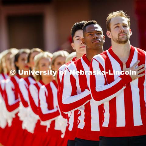 The Cheer Squad lines up and stands to attention for the Pledge of Allegiance. Nebraska vs. Northwestern University football game. Homecoming 2019. October 5, 2019.  Photo by Craig Chandler / University Communication.