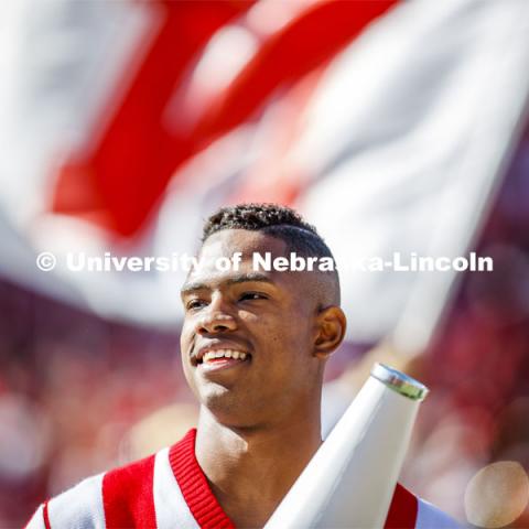 The male cheerleaders use their megaphones to rally the crowd. Nebraska vs. Northwestern University football game. Homecoming 2019. October 5, 2019.  Photo by Craig Chandler / University Communication.