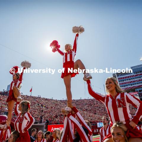 The Cheer Squad perform stunts at the Nebraska vs. Northwestern University football game. Homecoming 2019. October 5, 2019.  Photo by Craig Chandler / University Communication.