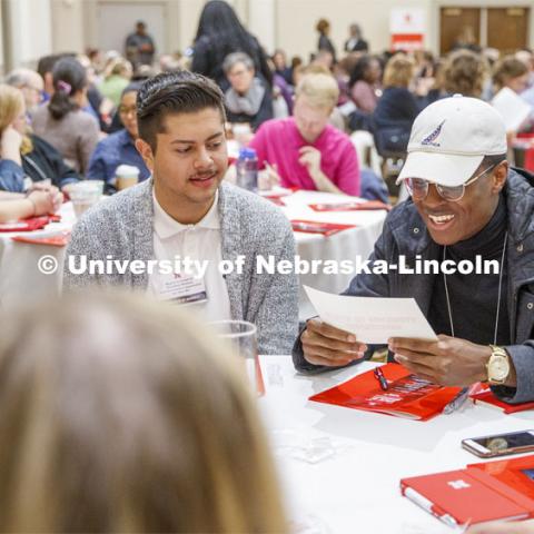 From left: Temi Onayemi, Miguel Avila Garcia, and Emy Kata talk over diversity discussion prompts as part of the State of Diversity summit in the Union Ballroom. October 29, 2019. Photo by Craig Chandler / University Communication.