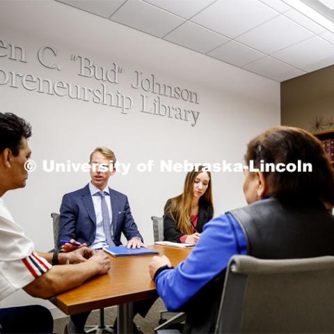 Third-year law students Brig Jensen and Nichole Sklare work with immigration clients in the University of Nebraska College of Law. Pictured to the right is second-year law student Eric Davis, who sat in to translate. November 15, 2019. Photo by Craig Chandler / University Communication.