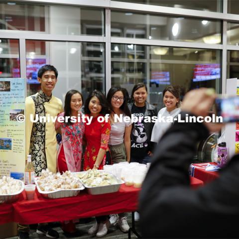 Vietnamese Student Association students pose for a photo at their booth. Global Huskers Festival, a multicultural festival provides attendees the chance to explore the world through informational booths that will have food, cultural décor, art, and more, each hosted by UNL students from those culture. November 19, 2019. Photo by Craig Chandler / University Communication.