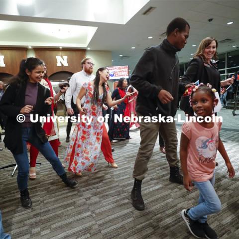 A group dances during a break in between performers. Global Huskers Festival, a multicultural festival provides attendees the chance to explore the world through informational booths that will have food, cultural décor, art, and more, each hosted by UNL students from those culture. November 19, 2019. Photo by Craig Chandler / University Communication.