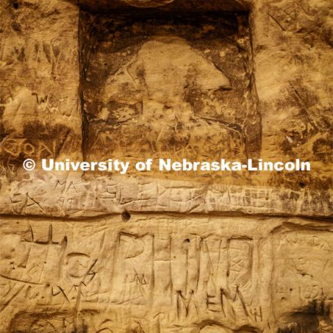 A rendering of the Sphinx is among thousands of names carved on the sandstone walls. Professor Ricky Wood uses LIDAR to digitally map Robbers Cave in Lincoln. November 22, 2019. Photo by Craig Chandler / University Communication.