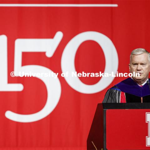 Regent Tim Clare gives remarks on the final N150 commencement weekend of the anniversary year. Graduate Commencement and Hooding at the Pinnacle Bank Arena. December 20, 2019. Photo by Craig Chandler / University Communication.