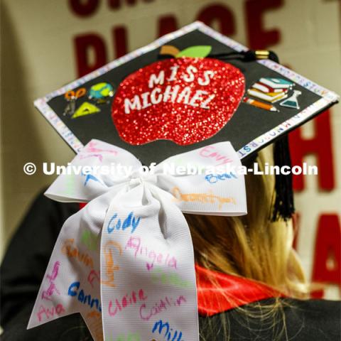 Olivia Michael had her students from her student teaching helped decorate her mortar board. December Undergraduate commencement at Pinnacle Bank Arena. December 21, 2019. Photo by Craig Chandler / University Communication.