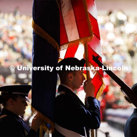 The ROTC march in carrying the flag. December Undergraduate commencement at Pinnacle Bank Arena. December 21, 2019. Photo by Craig Chandler / University Communication.
