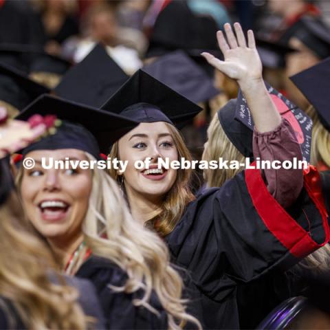 Alissa Ehrman waves to family and friends as she enters the arena. December Undergraduate commencement at Pinnacle Bank Arena. December 21, 2019. Photo by Craig Chandler / University Communication.