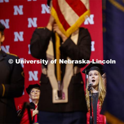 Susan Tweihaus, sings the national anthem at the December Undergraduate commencement at Pinnacle Bank Arena. December 21, 2019. Photo by Craig Chandler / University Communication.
