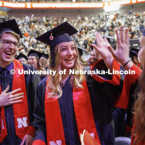 From right; Chase Nissen, Kristen Nett, and Danielle Nelson celebrate their graduation as part of Regent Clare's greeting to the students. December Undergraduate commencement at Pinnacle Bank Arena. December 21, 2019. Photo by Craig Chandler / University Communication.