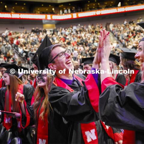 Chase Nissen, and Kristen Nett celebrate their graduation as part of Regent Clare's greeting to the students. December Undergraduate commencement at Pinnacle Bank Arena. December 21, 2019. Photo by Craig Chandler / University Communication.
