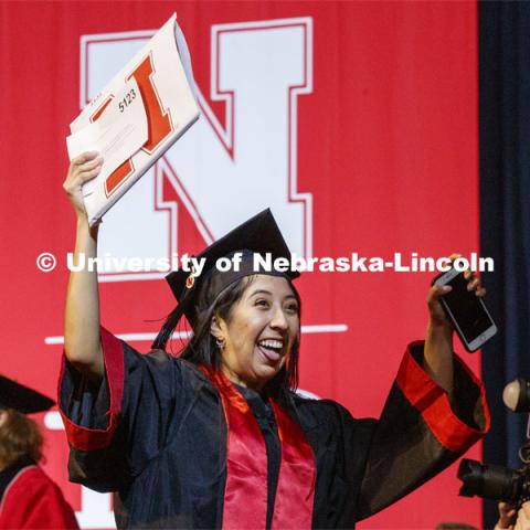 Doris Servan-Alvarez celebrates her Arts and Sciences diploma. December Undergraduate commencement at Pinnacle Bank Arena. December 21, 2019. Photo by Craig Chandler / University Communication.