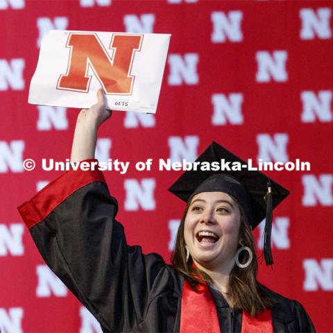 Kylie Tucker shows off her diploma to family and friends. December Undergraduate commencement at Pinnacle Bank Arena. December 21, 2019. Photo by Craig Chandler / University Communication.