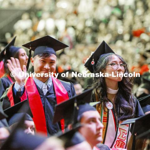 David Nguyen waves to his family. December Undergraduate commencement at Pinnacle Bank Arena. December 21, 2019. Photo by Craig Chandler / University Communication.