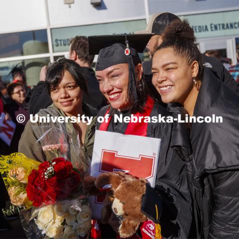 Athena Muhs and her family pose for photos after commencement. December Undergraduate commencement at Pinnacle Bank Arena. December 21, 2019. Photo by Craig Chandler / University Communication.