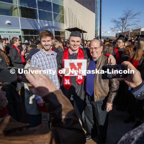 Stephen Lunde poses with family and friends after graduating with his PGA Golf Management degree. December Undergraduate commencement at Pinnacle Bank Arena. December 21, 2019. Photo by Craig Chandler / University Communication.