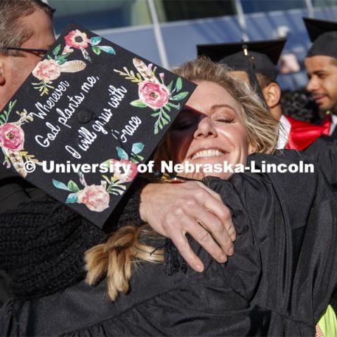 Alyssa Arndt is hugged by her mom, Jen, after the commencement. December Undergraduate commencement at Pinnacle Bank Arena. December 21, 2019. Photo by Craig Chandler / University Communication.